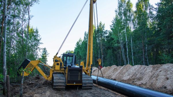 Crude oil and Natural gas pipeline construction work in forest area.  Installation the Petrochemical Pipe. Construction the Pipeline for transport gas to LNG plant