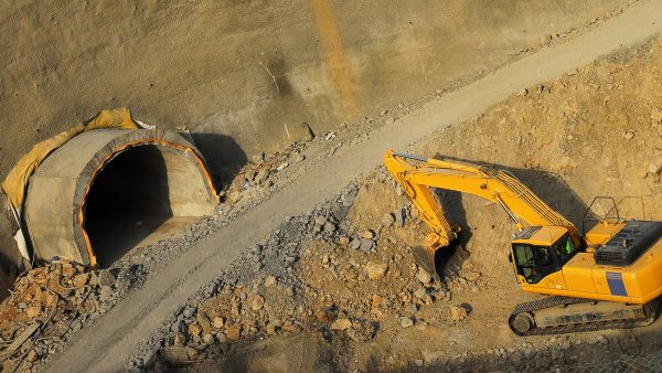 Yellow Excavator Working For Tunnel Construction